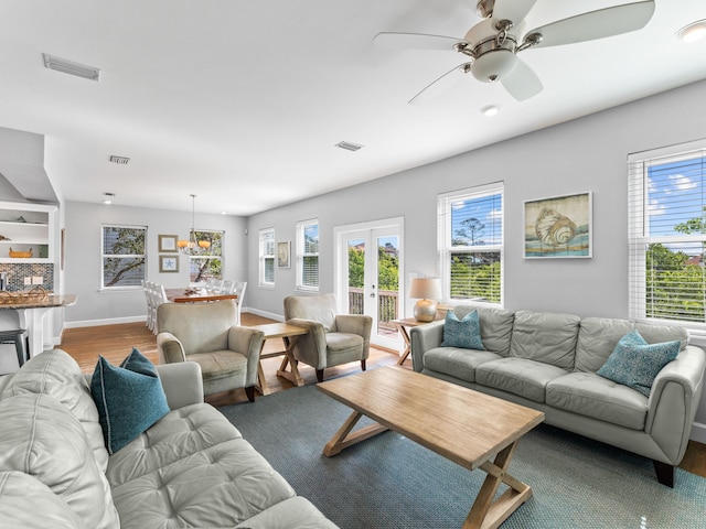 living room featuring french doors, hardwood / wood-style flooring, and ceiling fan