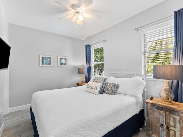 bedroom featuring wood-type flooring and ceiling fan