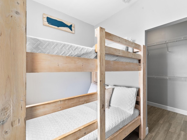 bedroom featuring a closet and wood-type flooring