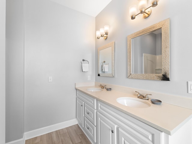 bathroom with vanity and hardwood / wood-style flooring