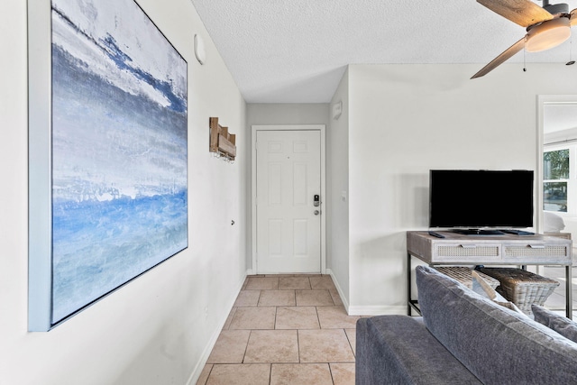 11 Beachside Dr Unit 1121, Santa Rosa Beach, FL 32459 - tiled foyer with a ceiling fan and a textured ceiling