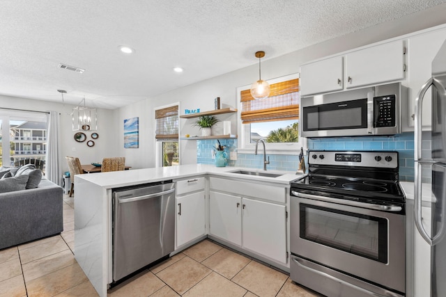 11 Beachside Dr Unit 1121, Santa Rosa Beach, FL 32459 - kitchen with stainless steel appliances, healthy amount of natural light, tasteful backsplash, a textured ceiling, and recessed lighting