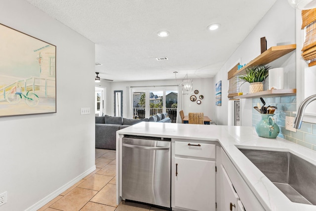 11 Beachside Dr Unit 1121, Santa Rosa Beach, FL 32459 - kitchen with stainless steel dishwasher, open shelves, a peninsula, white cabinets, and light countertops