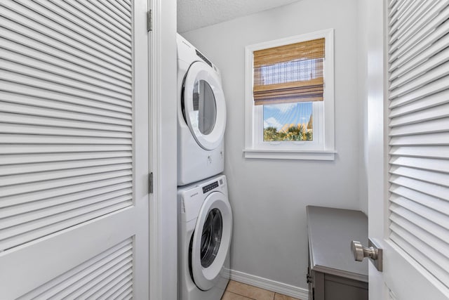 11 Beachside Dr Unit 1121, Santa Rosa Beach, FL 32459 - laundry room with stacked washing machine and dryer and light tile patterned floors