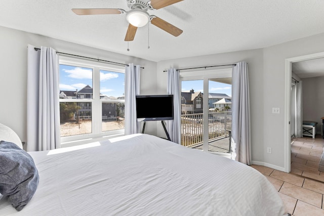 11 Beachside Dr Unit 1121, Santa Rosa Beach, FL 32459 - tiled bedroom featuring access to exterior, multiple windows, and a ceiling fan