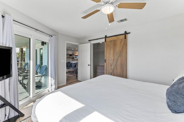 11 Beachside Dr Unit 1121, Santa Rosa Beach, FL 32459 - bedroom with a barn door, access to exterior, and a ceiling fan