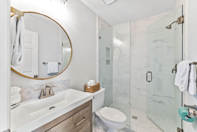 11 Beachside Dr Unit 1121, Santa Rosa Beach, FL 32459 - bathroom featuring a shower stall, vanity, and a textured ceiling