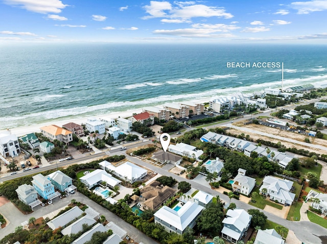 aerial view featuring a view of the beach and a water view