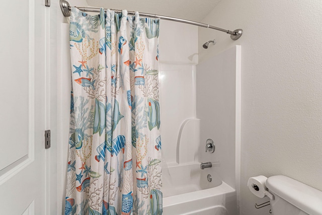 bathroom with shower / bath combo with shower curtain