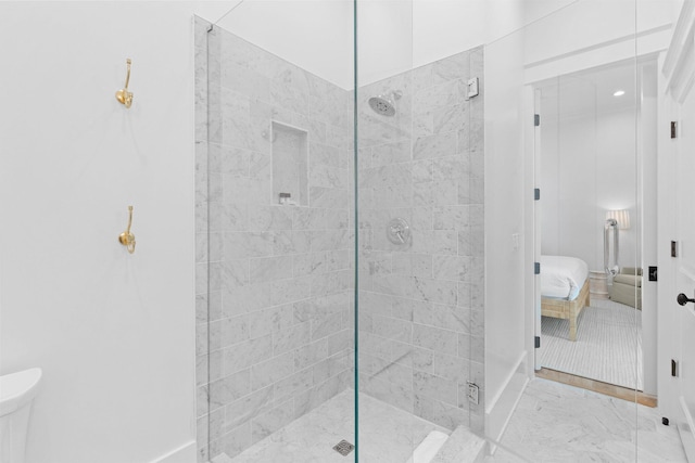 bathroom with a shower with door