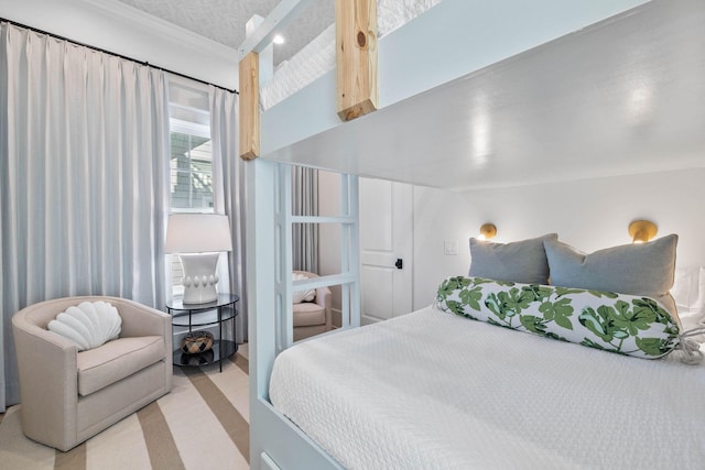 bedroom with light colored carpet and lofted ceiling