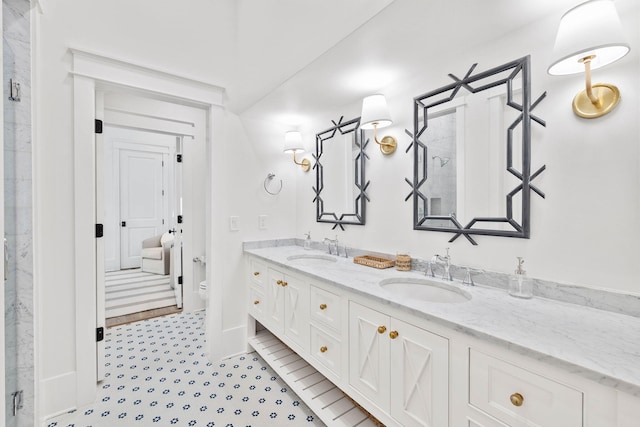 bathroom with tile patterned flooring, vanity, and toilet