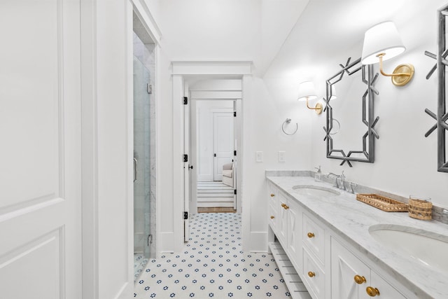 bathroom with tile patterned floors, a shower with door, and vanity