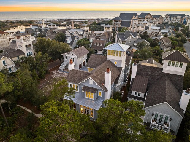 aerial view at dusk with a water view