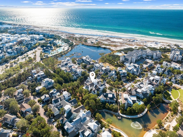 bird's eye view featuring a water view and a view of the beach