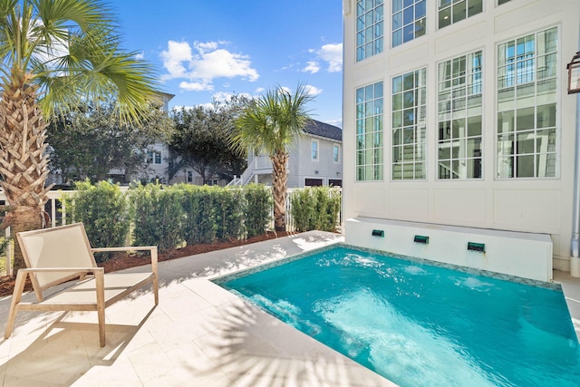 view of swimming pool featuring a patio area