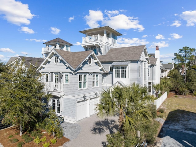 view of front of house with a balcony and a garage