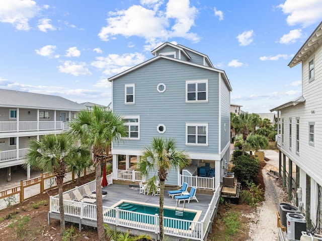 rear view of house with a wooden deck