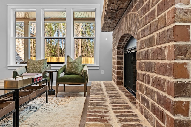 interior space featuring a brick fireplace