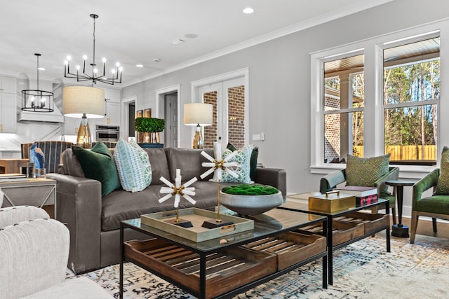 living room with a chandelier and crown molding