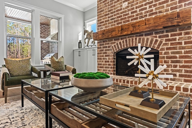 interior space featuring a wealth of natural light, a brick fireplace, crown molding, and brick wall