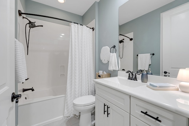 full bathroom featuring tile patterned flooring, vanity, shower / bath combo with shower curtain, and toilet