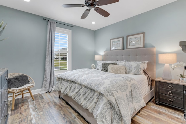 bedroom featuring ceiling fan and light hardwood / wood-style flooring