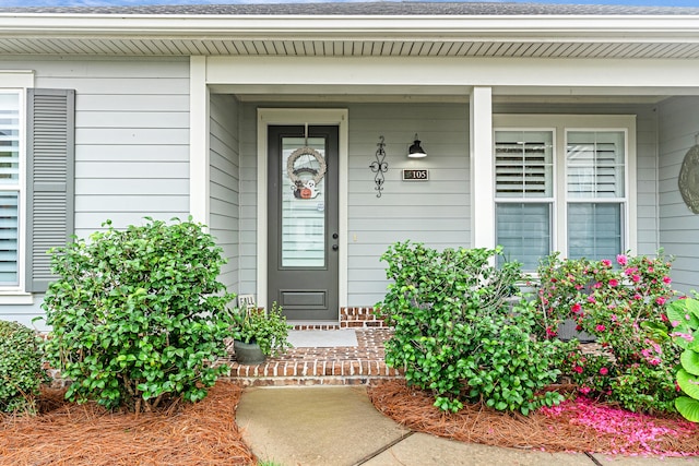 property entrance featuring covered porch