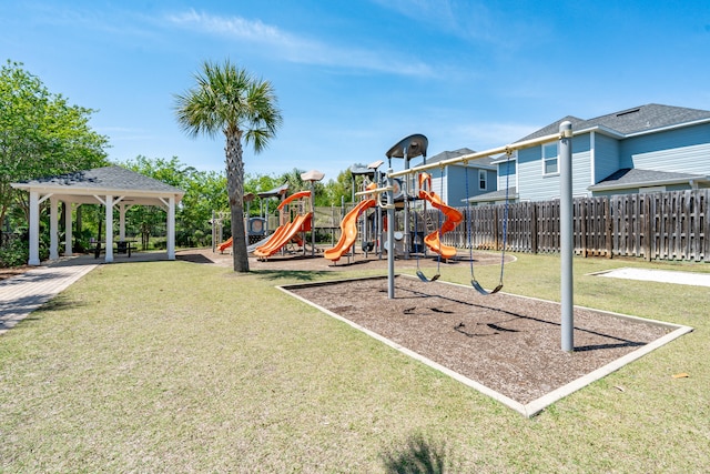 view of jungle gym featuring a lawn