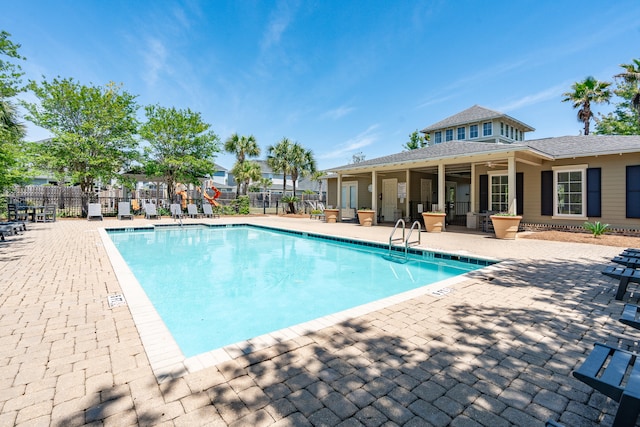 view of pool featuring a patio area