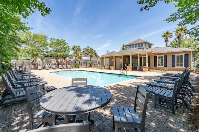 view of swimming pool featuring a patio area