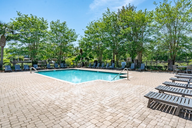 view of swimming pool featuring a patio