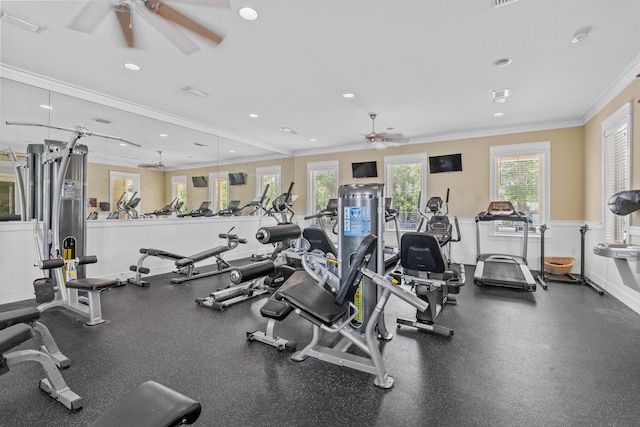 workout area featuring ornamental molding and ceiling fan