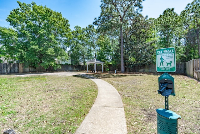 view of home's community with a yard and a gazebo