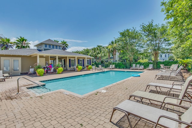 view of swimming pool with a patio