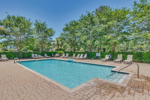 view of swimming pool with a patio area