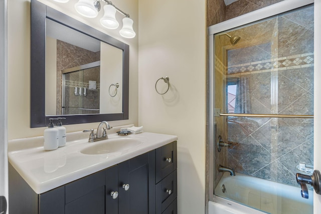 full bath with enclosed tub / shower combo and vanity