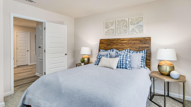 bedroom featuring hardwood / wood-style floors