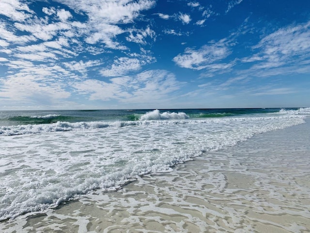 view of water feature with a beach view