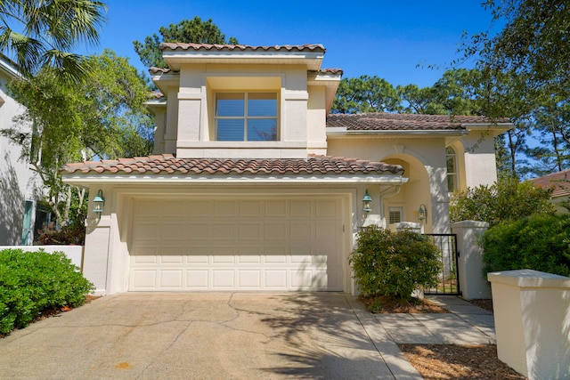 mediterranean / spanish-style house featuring a garage