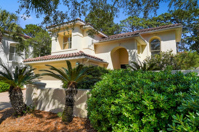 mediterranean / spanish-style house featuring a garage