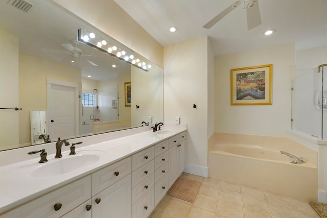 bathroom with plus walk in shower, vanity, and tile patterned flooring