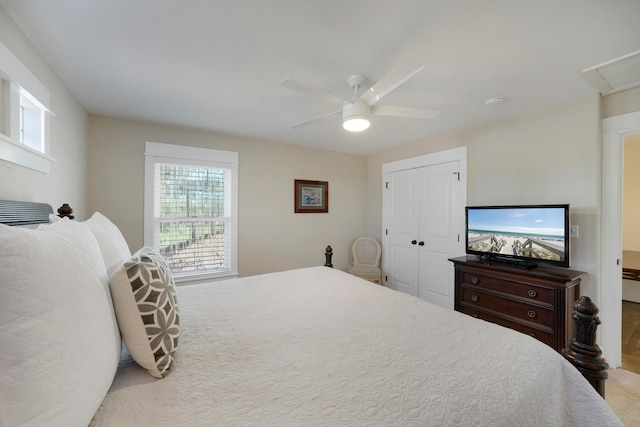 bedroom with carpet, ceiling fan, and a closet