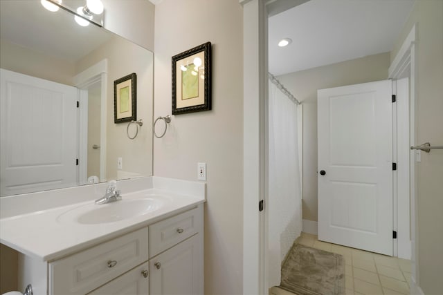 bathroom with tile patterned flooring and vanity