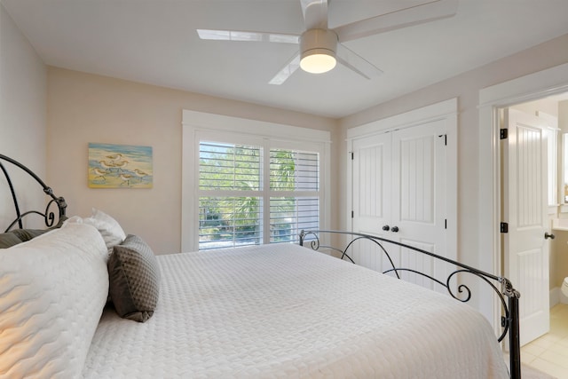 bedroom with ceiling fan and a closet