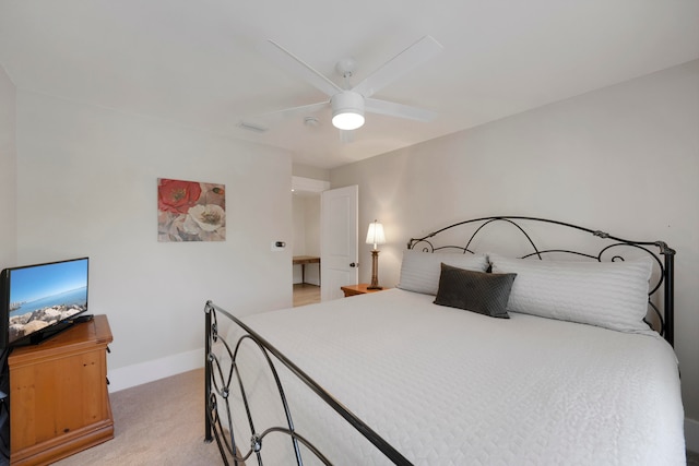 bedroom featuring light colored carpet and ceiling fan