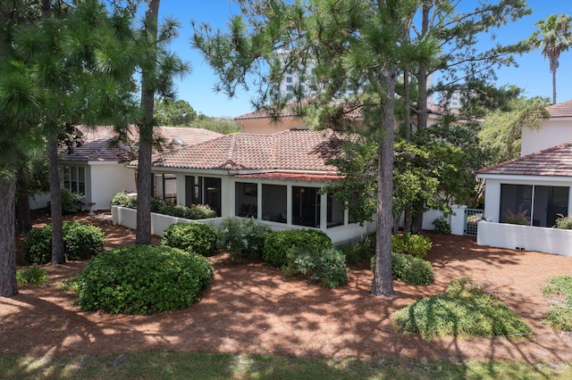 rear view of house with a sunroom