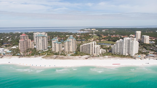 drone / aerial view featuring a view of the beach and a water view