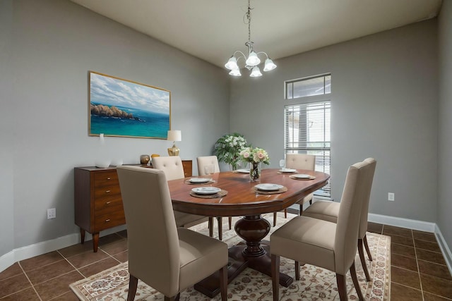 tiled dining area featuring a notable chandelier