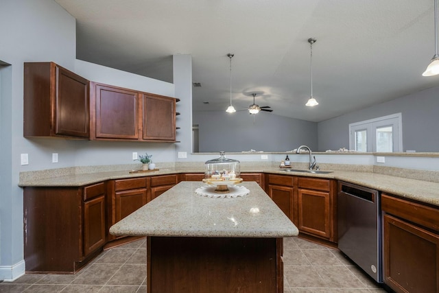 kitchen featuring pendant lighting, a center island, sink, vaulted ceiling, and stainless steel dishwasher